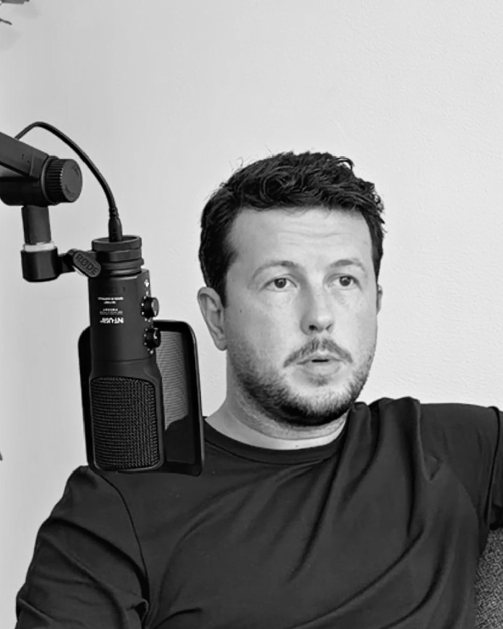 Josh recording a video, in black and white